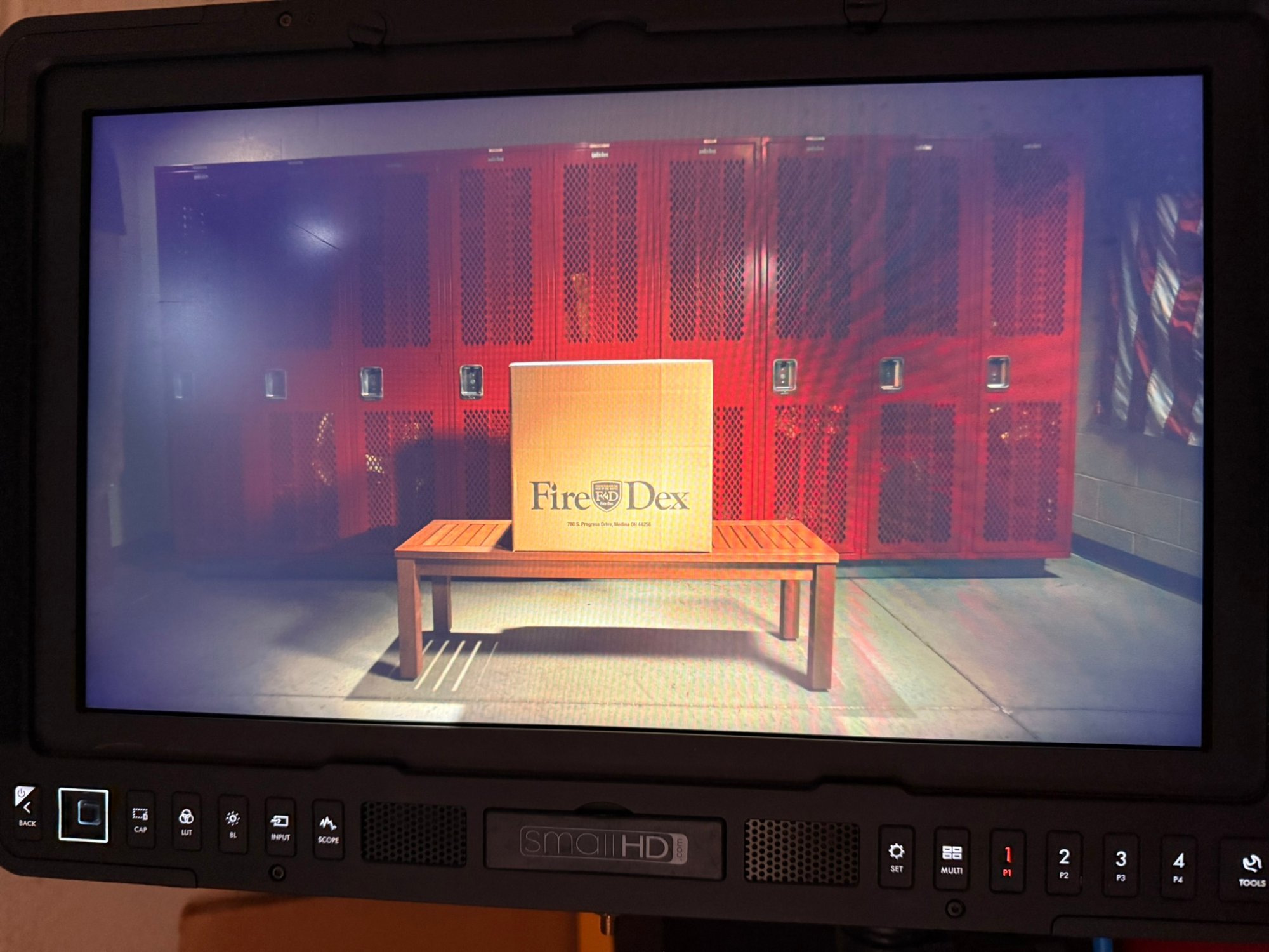 Monitor shot of Fire-Dex product photo featuring the box of gear